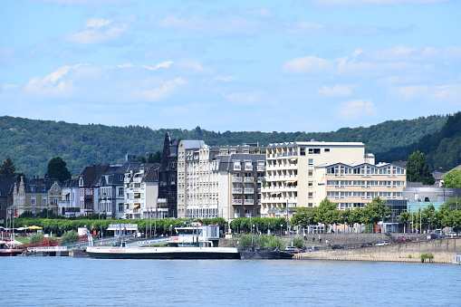 Königswinter, Germany - 06/28/2022: touristic waterfront with ships and hotels