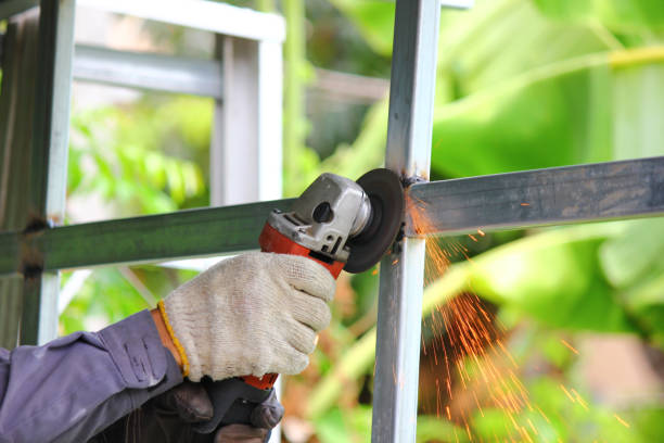 istock close up worker using angle grinder polishing steel structure with yellow sparks 1407866099