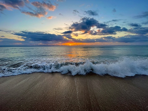 Daybeak Sunrise With Clouds At The Beach