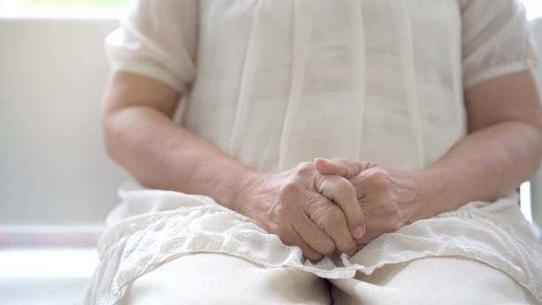 istock Stressed elder woman sitting on sofa. 1407866648