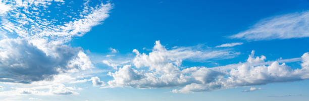 istock Panorama of blue sky with white clouds in clear weather 1407870728