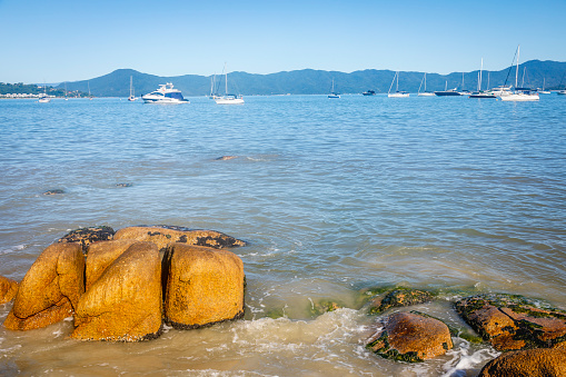 Beach with boats and sailboats in Jurere Internacional - Florianopolis, Brazil