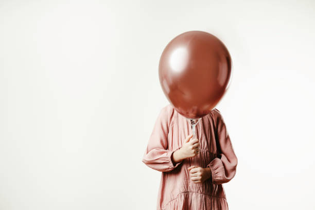 istock Girl with Balloon 1407874475