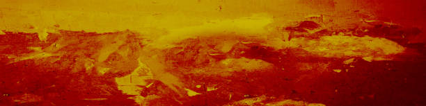 istock Yellow red grunge background. Painted rough concrete wall. Blood red background with space for design. Web banner. Wide. Panoramic. Website header. 1407875628