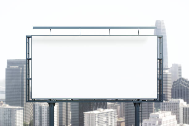istock Blank white horizontal billboard on skyline background at daytime, front view. Mock up, advertising concept 1407875850