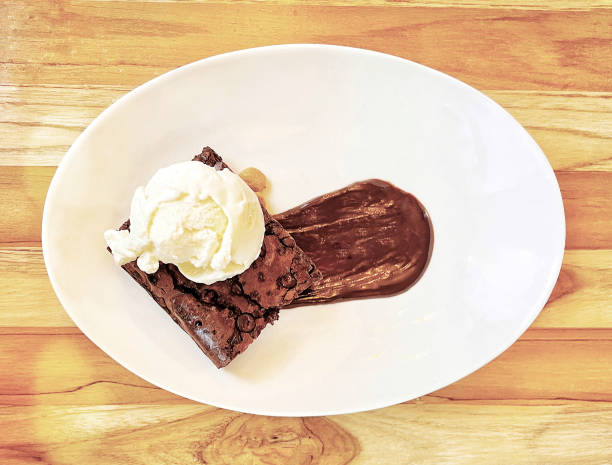 istock Fudge brownie  with vanilla ice cream and chocolate syrup dessert 1407877042