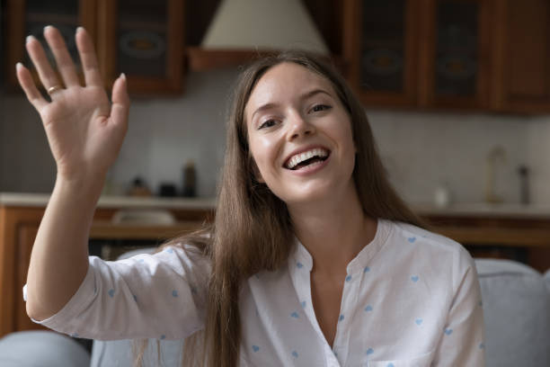 istock Young beautiful woman start communication through video call app 1407878232