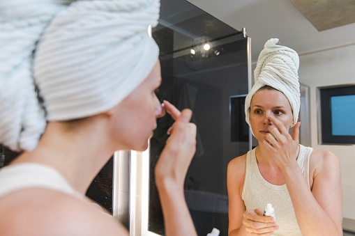 woman applying some face cream