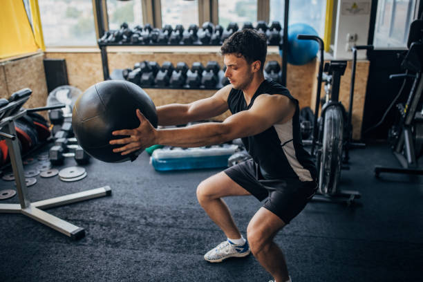 istock Man training with medicine ball 1407879051