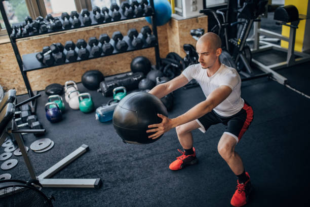 istock Man training with medicine ball 1407879166