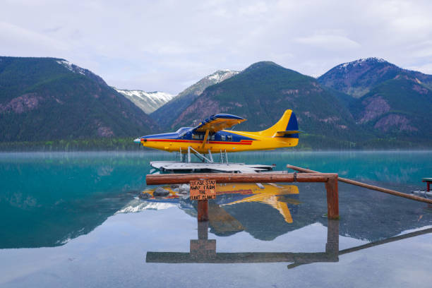 Floatplane Floatplane on Muncho Lake in northern British Columbia, Canada. bush plane stock pictures, royalty-free photos & images