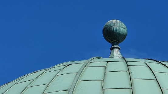 Green dome against blue sky