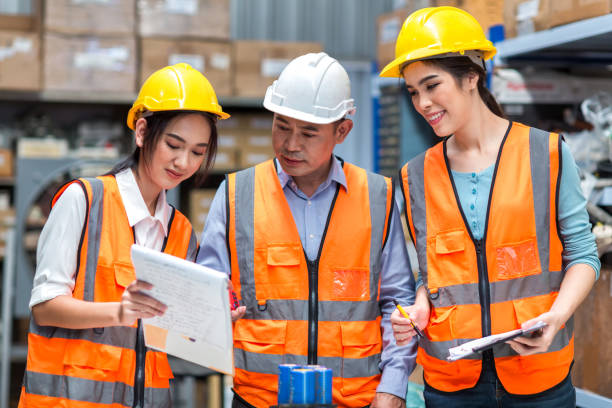 istock Team Foreman or Team worker working in warehouse. Industrial and industrial workers concept. worker woman order details and checking goods and Supplies. 1407886445