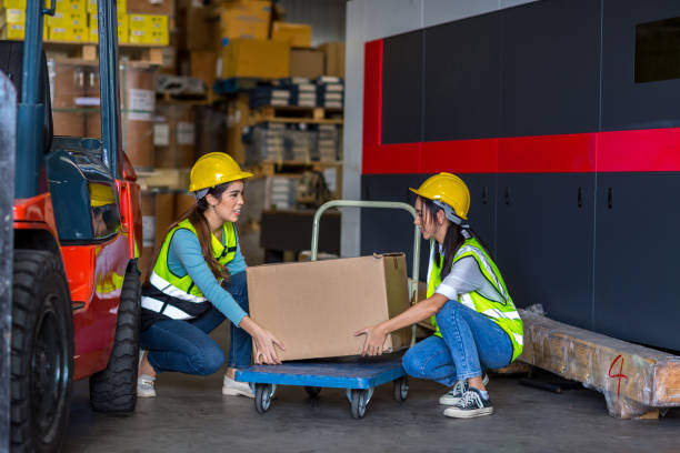 istock Team Foreman or Team worker working in warehouse. Industrial and industrial workers concept. worker woman order details and checking goods and Supplies. 1407887310