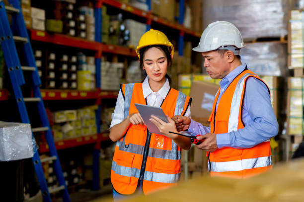 istock Team Foreman or Team worker working in warehouse. Industrial and industrial workers concept. worker woman order details and checking goods and Supplies. 1407888219