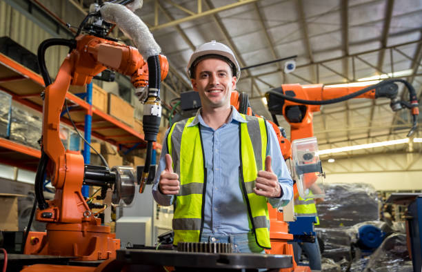 istock Engineer or Worker in intelligent factory industrial. Engineer check and control automation robot arms machine in intelligent factory industrial 1407888389