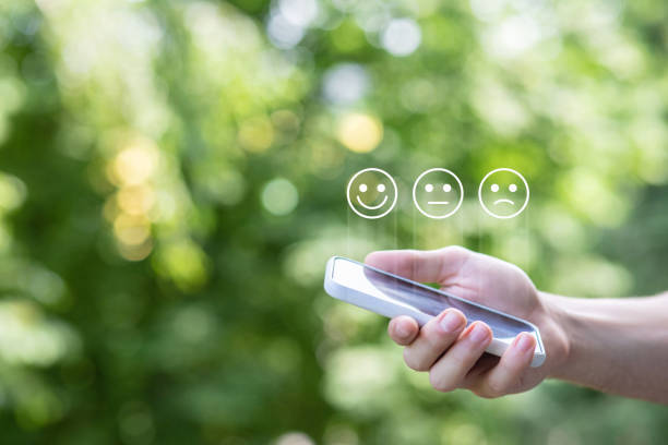 istock A hand with a phone shows emoticons of various emotions . 1407888490