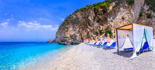 Photo of Greece. Best beaches of Corfu island. Stellaris paradise beach with crystal clear turquoise sea.  reachable only with a boats from Paleokastritsa.