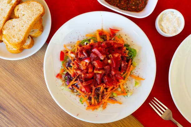 Turkish appetizer made of vegetables served on table Turkish appetizer made of tomatoes, carrot, lettuce, seasoned with spice and served on table. Relish stock pictures, royalty-free photos & images