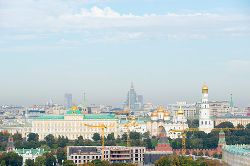 Moscow Kremlin and frozen river on a clear winter day.