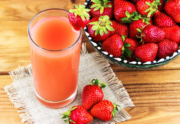 istock Strawberry drink in a glass with fresh berries 1407893910
