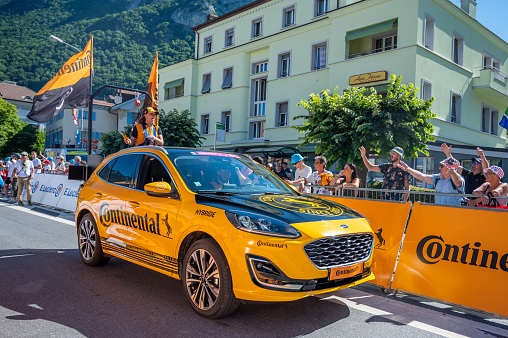 Aigle, Valais Canton, Switzerland - -July 10, 2022:  Passage of an advertising car of Continental in the caravan of the Tour de France in Switzerland.