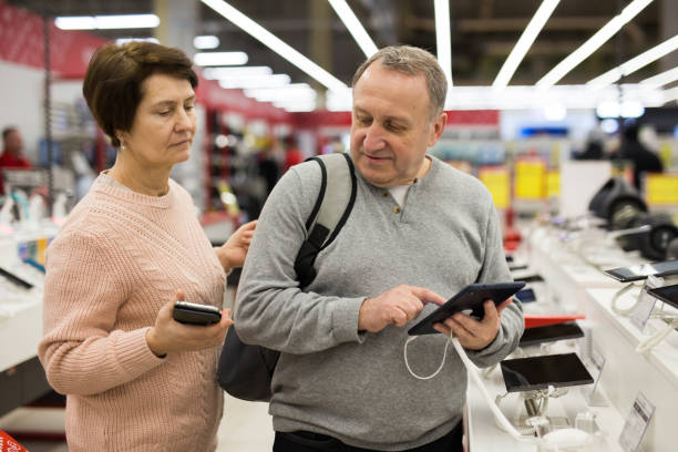 istock European man chooses a tablet 1407894253