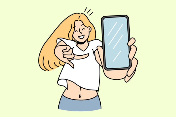 Smiling girl pointing at smartphone screen Smiling young woman pointing at cellphone screen show good sale deal or offer. Happy girl demonstrate new app on modern smartphone. Technology concept. Vector illustration. cartoon of the mobile phone charger stock illustrations