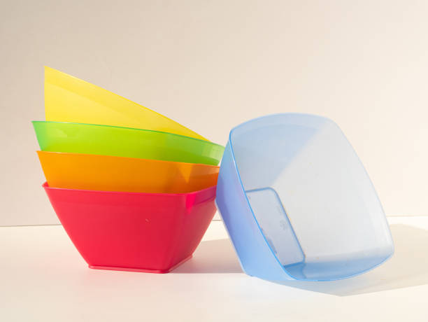 istock A stack of bright colorful square-shaped plastic salad bowls. The blue plate is next to the stack 1407895713