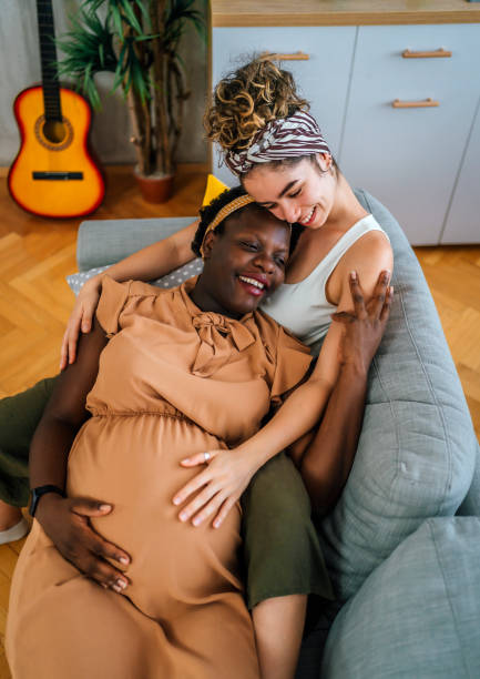 istock Happy pregnant lesbian couple 1407895980