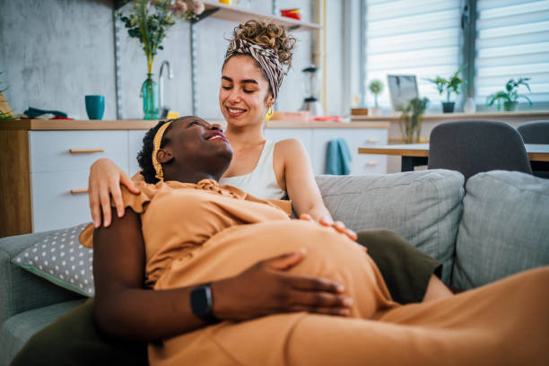 istock Happy pregnant lesbian couple 1407896440