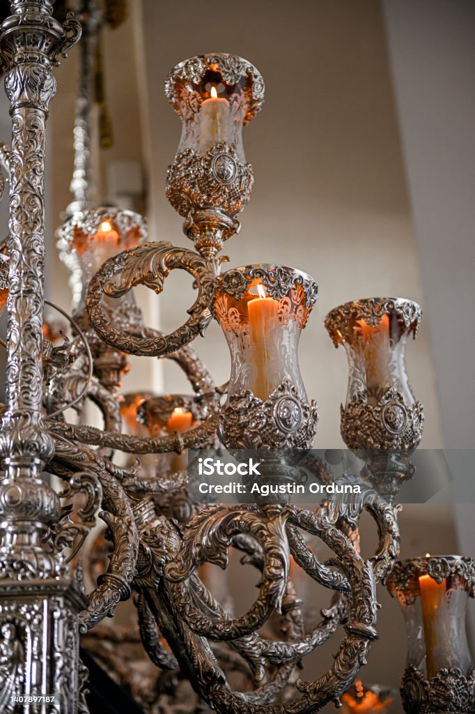 Tail candlesticks in the passage or throne of Holy Week Tail candlesticks in the passage or throne of Holy Week. Allegory Painting Stock Photo