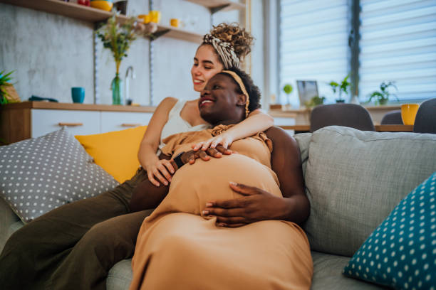 istock Happy woman hugging her pregnant girlfriend 1407897232