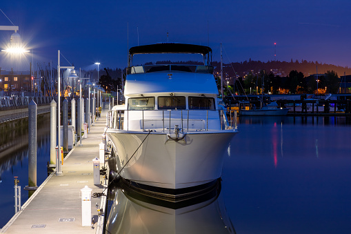 Everett, WA - USA: 06-08-2022:  Yacht moored in the evening at a waterfront pier