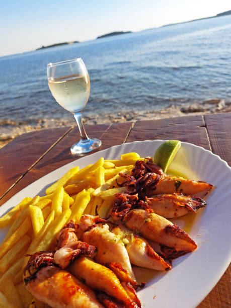 istock plate with grilled squids and fries 1407898618