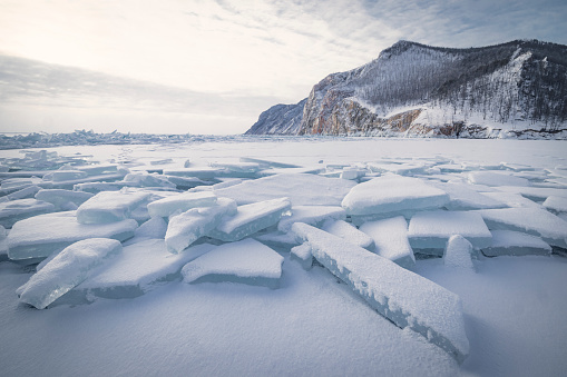 broken ice sheets on frozen lake in Siberia