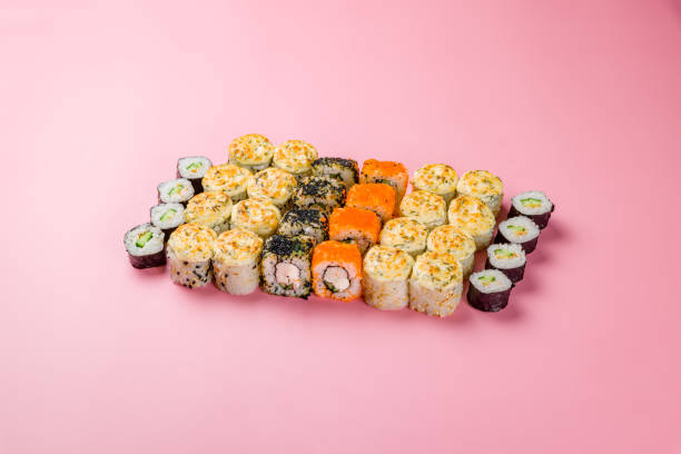 istock set of different rolls and sushi on pink background 1407898768