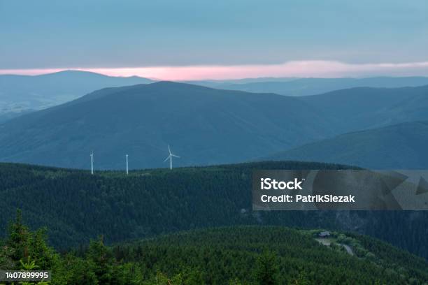 Wind Turbines In Bear Mountain View From Upper Water Reservoir Of The Pumped Storage Hydro Power Plant Dlouhe Strane In Jeseniky Mountains Czech Republic Summer Sunset Stock Photo - Download Image Now