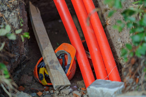istock Security violations. The worker's helmet is broken with a wooden beam. Lies in a pit. 1407901526