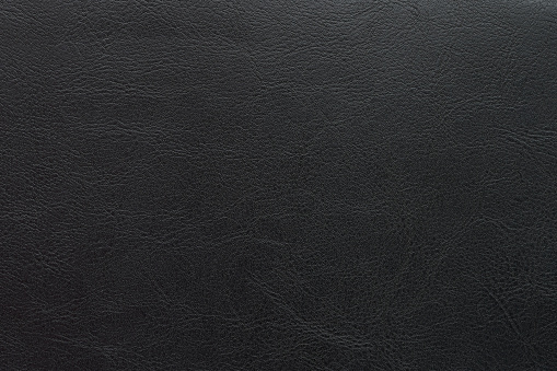 Genuine quality black leather surface macro close up view