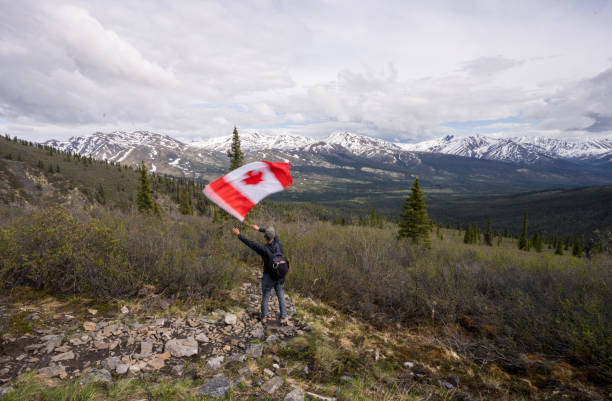 istock Tombstone Territorial Park and man with Canada flag 1407909779