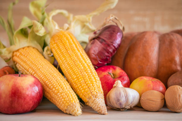 Thanksgiving background with vegetables and fruits.