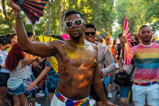 Madrid, Spain: July 9, 2022: Black ethnic pride dancers at the gay, lgbt, lgtbi pride parade party in Madrid, rainbow