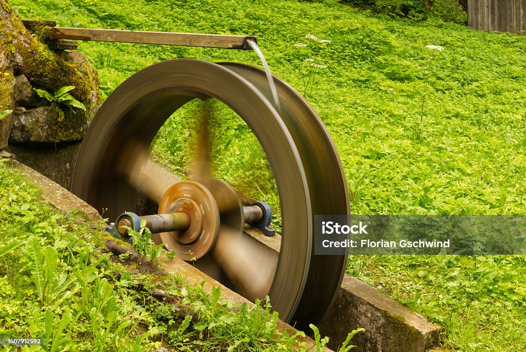 Spinning water wheel History Stock Photo