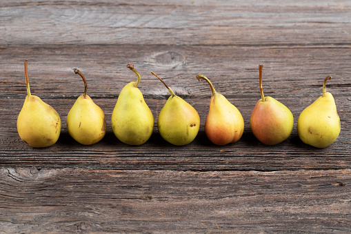 Pears on  wooden background