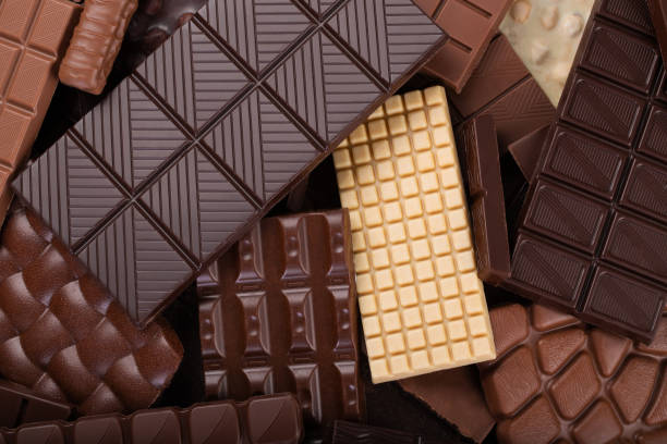 istock Bitter and milk chocolate background, sweet cocoa dessert. 1407913595
