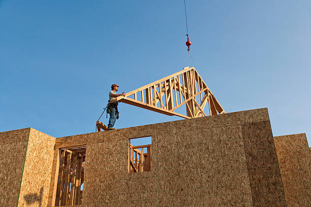istock Roof Trusses Being Hoisted Onto Unfinished Home Frame 140791922