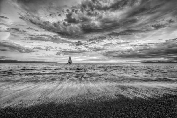 istock Sunset Sailboat Landscape Ocean Clouds Black And White 1407921707