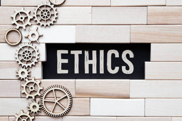 torn paper with word ethics.