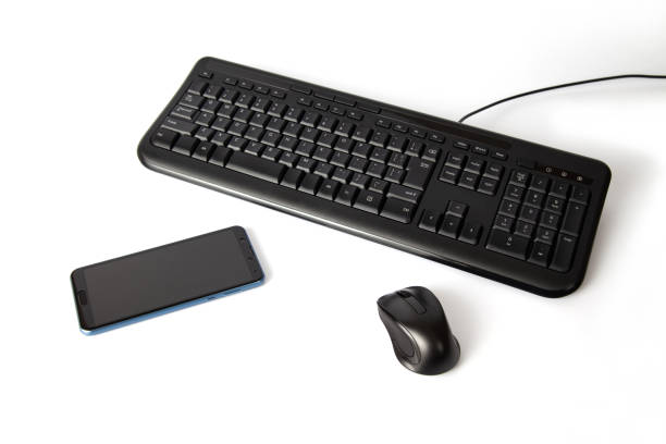 istock black keyboard and mouse smartphone isolated on white background 1407935405